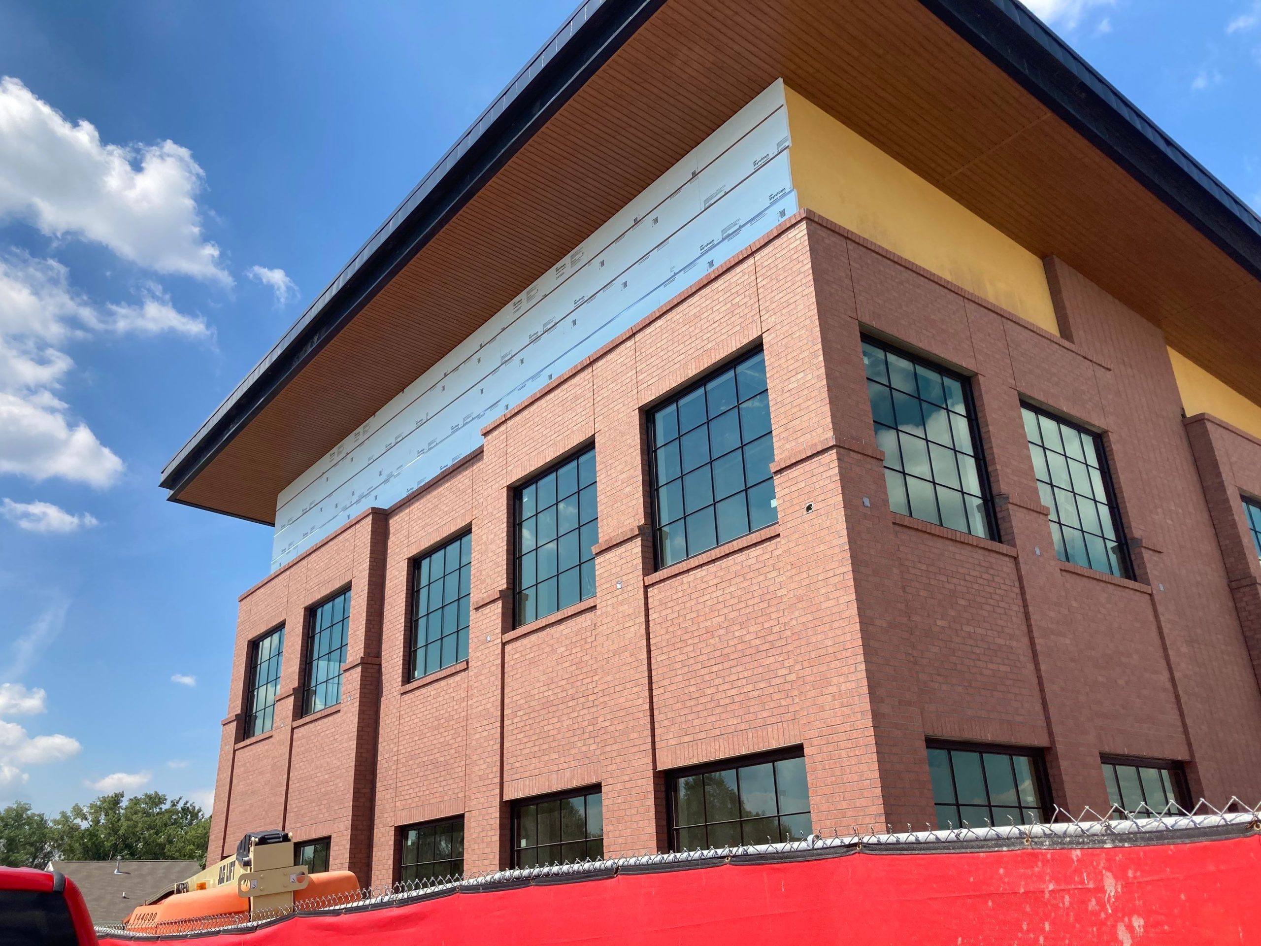 new soffit and siding being added to a Commercial brick building in Omaha, NE